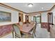 Charming dining room with decorative walls, wood trim, and an adjacent living space at 2071 Habersham Cir, Covington, GA 30014