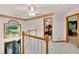 Foyer with an ornate chandelier, staircase with wood handrail, and views into other rooms at 2071 Habersham Cir, Covington, GA 30014