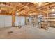 Spacious garage interior showcasing exposed beams, two large doors, and ample storage space at 2071 Habersham Cir, Covington, GA 30014