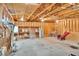 Large garage interior featuring exposed beams, two large doors, storage, and versatile workspace at 2071 Habersham Cir, Covington, GA 30014