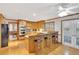 Open kitchen with stainless appliances, breakfast bar, and hardwood flooring at 2071 Habersham Cir, Covington, GA 30014