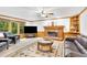 Comfortable living room with a fireplace, hardwood trim, and large windows at 2071 Habersham Cir, Covington, GA 30014