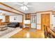 Cozy living room with a leather couch, a desk nook, and hardwood floors at 2071 Habersham Cir, Covington, GA 30014