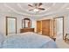 Large main bedroom featuring multiple closets, carpet flooring, and tray ceilings at 2071 Habersham Cir, Covington, GA 30014