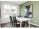 Cozy dining area featuring a white table, stylish chairs, and ample natural light at 2682 Brookview Nw Ln, Atlanta, GA 30318