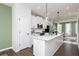 Modern kitchen features white cabinets, stainless steel appliances, and a center island at 2682 Brookview Nw Ln, Atlanta, GA 30318