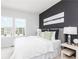 Stylish main bedroom features a serene ambiance, large windows, and elegant furnishings at 2682 Brookview Nw Ln, Atlanta, GA 30318