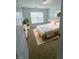 Bright bedroom with a large window, neutral walls, and a minimalist design at 5050 Roxton Ln, Douglasville, GA 30135