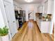 Bright kitchen featuring stainless steel appliances, white cabinets, hardwood floors and granite countertops at 5050 Roxton Ln, Douglasville, GA 30135
