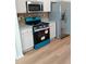 Well-lit kitchen featuring stainless steel appliances, granite countertops, and white cabinets at 5050 Roxton Ln, Douglasville, GA 30135