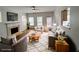 Cozy living room with fireplace, plush seating, large windows, and neutral color palette at 5050 Roxton Ln, Douglasville, GA 30135