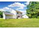 The expansive backyard features a well-maintained lawn and detached garage at 5484 Denny Dr, Atlanta, GA 30349