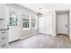 Bright dining area with large windows and sleek floors provides an inviting space for meals and gatherings at 5484 Denny Dr, Atlanta, GA 30349