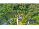 Aerial view showcasing a home with lush trees and a verdant lawn surrounding the property at 69 Southern Trace Way, Rockmart, GA 30153
