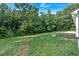 Spacious backyard featuring lush greenery and mature trees, providing a private and serene outdoor space at 69 Southern Trace Way, Rockmart, GA 30153