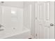 Bathroom featuring a white bathtub and shower combination at 69 Southern Trace Way, Rockmart, GA 30153
