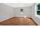 Bright bedroom with hardwood floors and a window overlooking the backyard at 69 Southern Trace Way, Rockmart, GA 30153