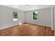 Sunlit bedroom featuring hardwood floors and view of the backyard at 69 Southern Trace Way, Rockmart, GA 30153