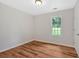 Bedroom featuring hardwood floors and a window overlooking the backyard at 69 Southern Trace Way, Rockmart, GA 30153