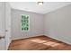 Bedroom featuring hardwood floors and a window at 69 Southern Trace Way, Rockmart, GA 30153