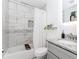 Bathroom showing white marble-look tile in the shower and a single sink vanity at 706 Powder Springs Se St, Smyrna, GA 30080