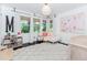 Charming bedroom with natural light, white walls, and hardwood floors at 706 Powder Springs Se St, Smyrna, GA 30080