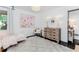 Another view of the charming bedroom featuring hardwood floors and a decorative painting at 706 Powder Springs Se St, Smyrna, GA 30080