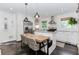 Modern kitchen featuring stainless steel appliances, white cabinets, and an eat-in island at 706 Powder Springs Se St, Smyrna, GA 30080