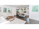 Open concept kitchen featuring stainless steel appliances, white cabinets, and eat-in island at 706 Powder Springs Se St, Smyrna, GA 30080