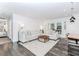 Bright living room with white walls, dark wood floors, and a cozy sectional sofa at 706 Powder Springs Se St, Smyrna, GA 30080