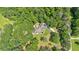 Aerial view of the home surrounded by lush greenery showcasing its private setting at 14 Black Forest Run, Douglasville, GA 30134