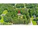 Aerial view showing the property surrounded by lush greenery in a residential neighborhood at 14 Black Forest Run, Douglasville, GA 30134