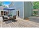 Wooden deck offers a large seating area and access to the house through sliding glass doors at 14 Black Forest Run, Douglasville, GA 30134