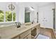 Modern bathroom with double sink vanity, large windows, and updated fixtures at 14 Black Forest Run, Douglasville, GA 30134