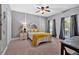 Inviting bedroom featuring large windows, a comfortable bed, and soothing color palette at 14 Black Forest Run, Douglasville, GA 30134