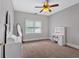 Bedroom showcases a makeup vanity, large mirrors, and neutral carpet, creating an elegant space at 14 Black Forest Run, Douglasville, GA 30134