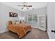 Bedroom featuring a queen bed, window, and bookcase creating a serene and organized space at 14 Black Forest Run, Douglasville, GA 30134
