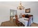 Bright dining room with hardwood floors, classic wainscoting, and ample space for entertaining at 14 Black Forest Run, Douglasville, GA 30134