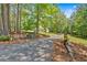 Scenic driveway leading to the home with stone retaining walls and lush greenery at 14 Black Forest Run, Douglasville, GA 30134