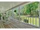 Charming front porch with rocking chairs and a scenic view, perfect for relaxing outdoors at 14 Black Forest Run, Douglasville, GA 30134