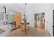View of kitchen with light wood accents leading to living room at 14 Black Forest Run, Douglasville, GA 30134