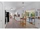 Spacious kitchen with white cabinets, modern appliances, and a view into the dining area at 14 Black Forest Run, Douglasville, GA 30134