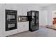 Updated kitchen featuring double ovens, stainless steel appliances, and ample cabinet space at 14 Black Forest Run, Douglasville, GA 30134