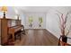 Bright living room with hardwood floors and large windows offering a scenic view at 14 Black Forest Run, Douglasville, GA 30134