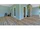 Inviting porch with a stone column feature and a welcome sign at 14 Black Forest Run, Douglasville, GA 30134