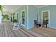 Relaxing front porch with rocking chairs, perfect for enjoying the outdoors at 14 Black Forest Run, Douglasville, GA 30134
