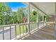 Spacious porch overlooking the driveway and lush landscaping at 14 Black Forest Run, Douglasville, GA 30134