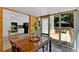 Bright sunroom with dining area and views to back yard at 14 Black Forest Run, Douglasville, GA 30134