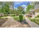 Beautiful backyard featuring lush landscaping, a pool, and a charming playhouse at 522 Golfview Dr, Peachtree City, GA 30269