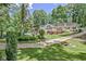 Expansive backyard featuring a pool, a deck, and lush lawn, perfect for outdoor enjoyment and entertaining guests at 522 Golfview Dr, Peachtree City, GA 30269